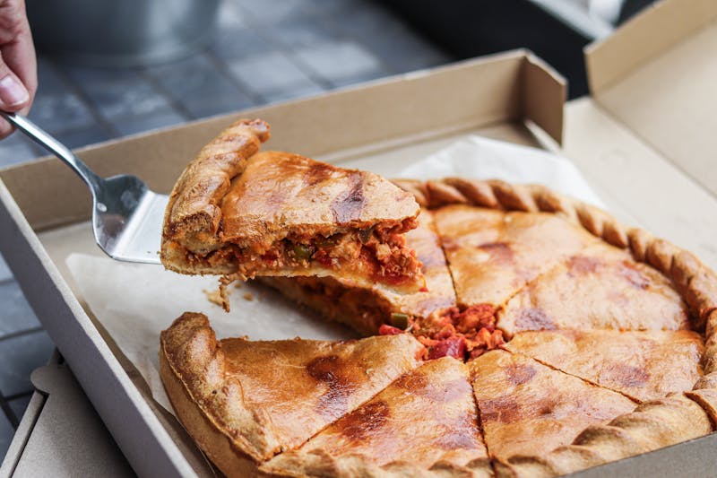 Thin crust margherita pizza with fresh basil